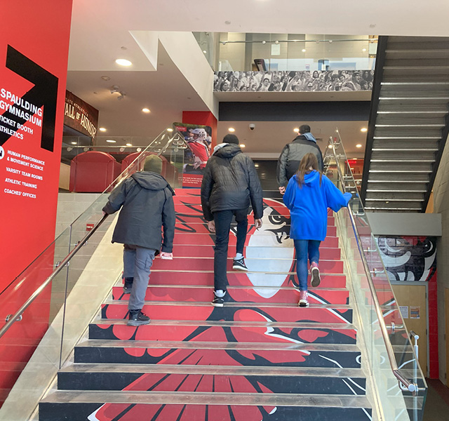 Students climb the stairs at Spaulding Gym at Keene State College